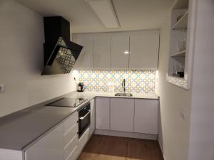 Kuchyňa alebo kuchynka v ubytovaní Moderno Apartamento Colon con Vistas al Mar Calpe