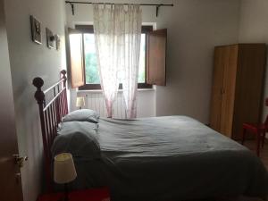 Postel nebo postele na pokoji v ubytování Appartamenti Il Capomandro
