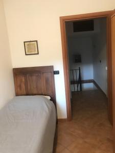Postel nebo postele na pokoji v ubytování Appartamenti Il Capomandro