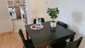 a table with a plate of food and a plant on it at 2 bedroom flat on Main Street in Gibraltar