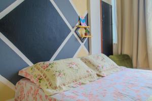 Posteľ alebo postele v izbe v ubytovaní Dois em cena - apartamento aconchegante e tranquilo no Centro do Rio