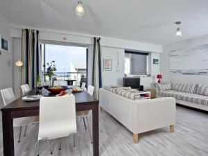 a living room with a table and a couch at Apartment 7, Ocean 1 in Crantock