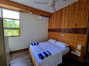Postel nebo postele na pokoji v ubytování Finolhu Beach Guest House