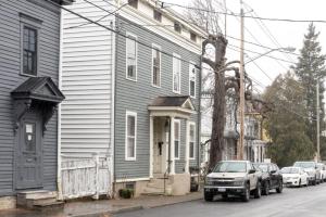 a truck parked in front of a house on a street at Hudson Valley Retreat in Downtown Hudson, NY - Sleeps 16-20 in Hudson
