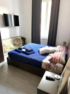 A bed or beds in a room at Ami House Roma