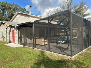 a screened in porch of a house at Fun Country Living in Dover +17 photos