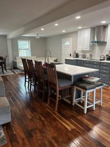 a kitchen with a table and chairs in a kitchen at Fun Country Living in Dover