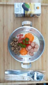 a plate of food with eggs and nuts on a table at Na cha lae 2 in Chanthaburi