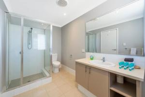 a bathroom with a glass shower and a sink at 4Shore with Wifi in Wonnerup +37 photos