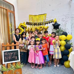 a group of children posing for a picture in front of a party at Mai Anh Garden in Soc Trang +50 photos