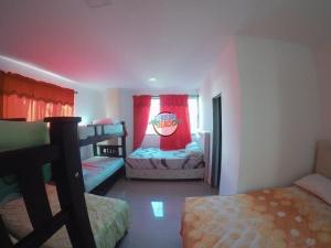 a bedroom with two bunk beds and a window at Special Life Beach in Tubará +8 photos