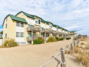 a row of apartment buildings on the beach at Tybee Lights 110C in Tybee Island