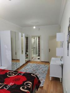 a bedroom with a bed and a dresser and a mirror at اسطنبول اسنيورت ستار تاورز in Esenyurt