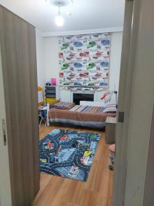 a room with a bedroom with a bed and a rug at اسطنبول اسنيورت ستار تاورز in Esenyurt