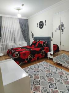 a bedroom with a bed and a rug at اسطنبول اسنيورت ستار تاورز in Esenyurt