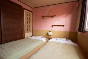 Postel nebo postele na pokoji v ubytování Guesthouse Bon