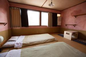 Postel nebo postele na pokoji v ubytování Guesthouse Bon