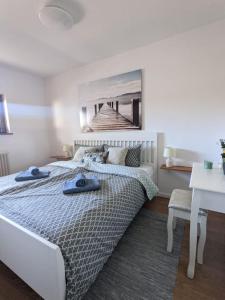Postel nebo postele na pokoji v ubytování Ferienwohnung für 4 Gäste in Grömitz