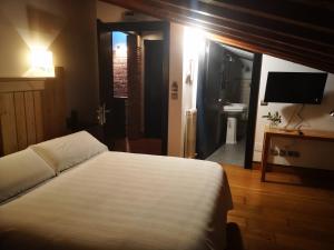 Postel nebo postele na pokoji v ubytování Posada Los Calderones