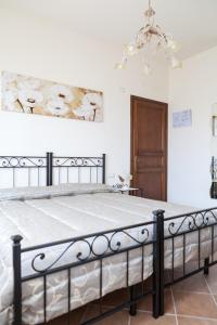 a bedroom with a large bed in a room at Dolce Sosta in Lucca