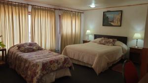 Cama o camas de una habitación en Hotel Cruz del Sur
