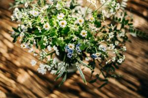 a bouquet of flowers in a vase on a table at Seaside 43 in Sankt Peter-Ording
