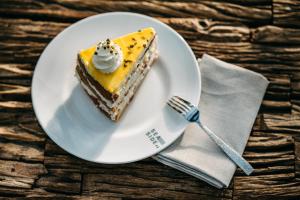 a piece of cake on a plate with a fork at Seaside 43 in Sankt Peter-Ording