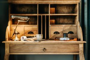 a wooden dresser with a lamp on top of it at Seaside 43 in Sankt Peter-Ording