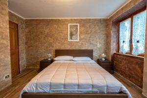Postel nebo postele na pokoji v ubytování San Luigi - Rooms & Apartments