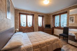 Postel nebo postele na pokoji v ubytování San Luigi - Rooms & Apartments
