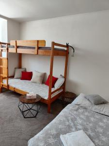 Postel nebo postele na pokoji v ubytování Apartmány Hágy L+L