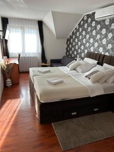 Postel nebo postele na pokoji v ubytování Pansion Villa Cancar