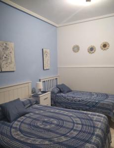 เตียงในห้องที่ Casa Hostal Olga - Castilla y León