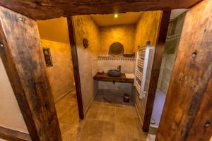 an overhead view of a bathroom with a sink at Domaine de la Ferté Clairbois in Sainte-Suzanne