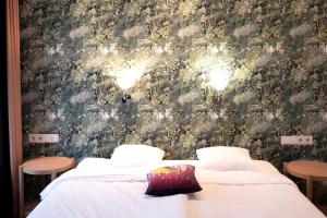 Postel nebo postele na pokoji v ubytování Hotel Finn