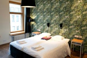 Postel nebo postele na pokoji v ubytování Hotel Finn