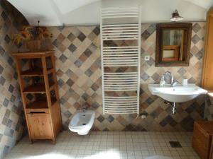 a bathroom with a sink and a toilet at Apartment Bohinjčan in Bohinj