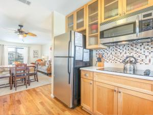 a kitchen with a stainless steel refrigerator at Lighthouse Point 4B in Tybee Island