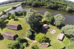 an aerial view of an island in a lake at Uniek overnachten in de prehistorie in Lelystad