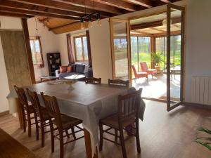 a dining room with a large table and chairs at Les Galets in Auchonvillers