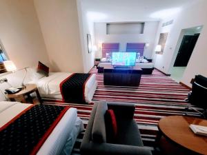 Een TV en/of entertainmentcenter bij Wonder Palace Hotel Qatar
