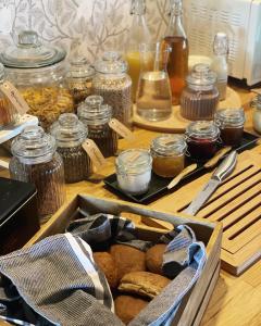 a box of bread and jars of food on a table at Hova Prästgård Bed & Breakfast in Hova