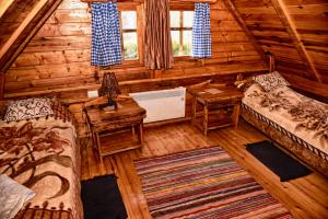 an overhead view of a bedroom in a log cabin at Guesthouse Peto in Novi Kneževac