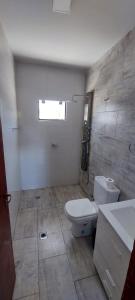 a bathroom with a toilet and a sink at Complejo Junin Dpto Planta Alta in Formosa