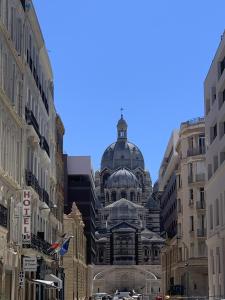 a large building with a dome on top of it at La Purple Suite in Marseille