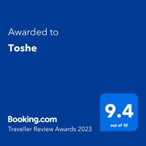 a blue screen with the text awarded to totezer review awards at Toshe in Ohrid