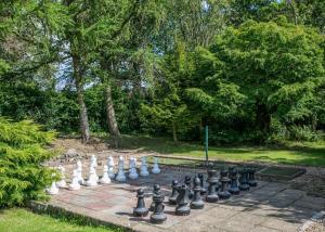 a chess set on a brick in a park at Blaithwaite Country House Estate in Wigton