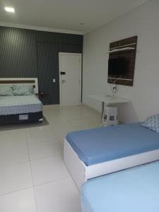 Katil atau katil-katil dalam bilik di Loft Bombinhas Van Gogh