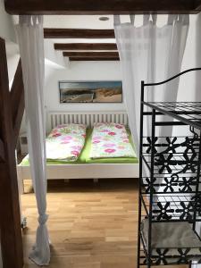 Postel nebo postele na pokoji v ubytování Ferienwohnung Romantica 1. und 2. OG