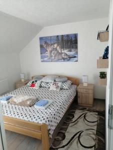 Tempat tidur dalam kamar di Apartmani NECA Zlatar
